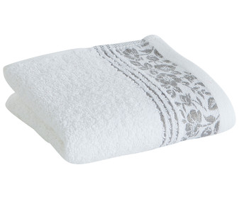 Toalla de tocador 100% algodón color blanco con cenefa de flores grises, 500g/m² ACTUEL. Toalla de tocador 100% algodón color blanco con cenefa de flores grises, 500g/m² ACTUEL.